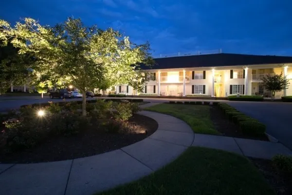 a view of a swimming pool with an outdoor space and seating area