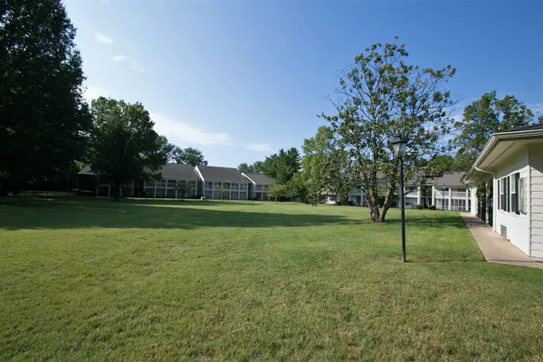 a view of a house with a big yard