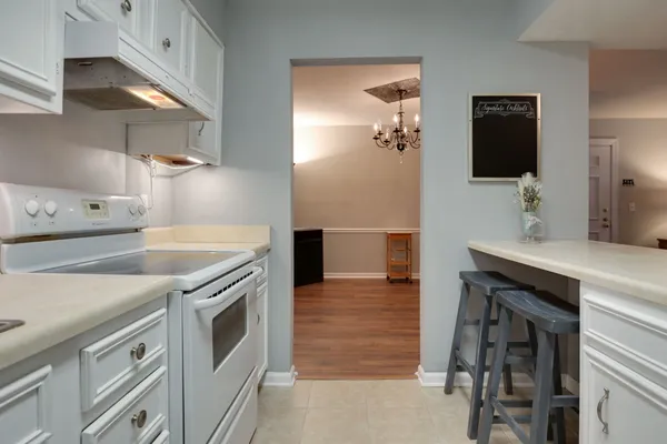 a kitchen with a sink and a stove top oven