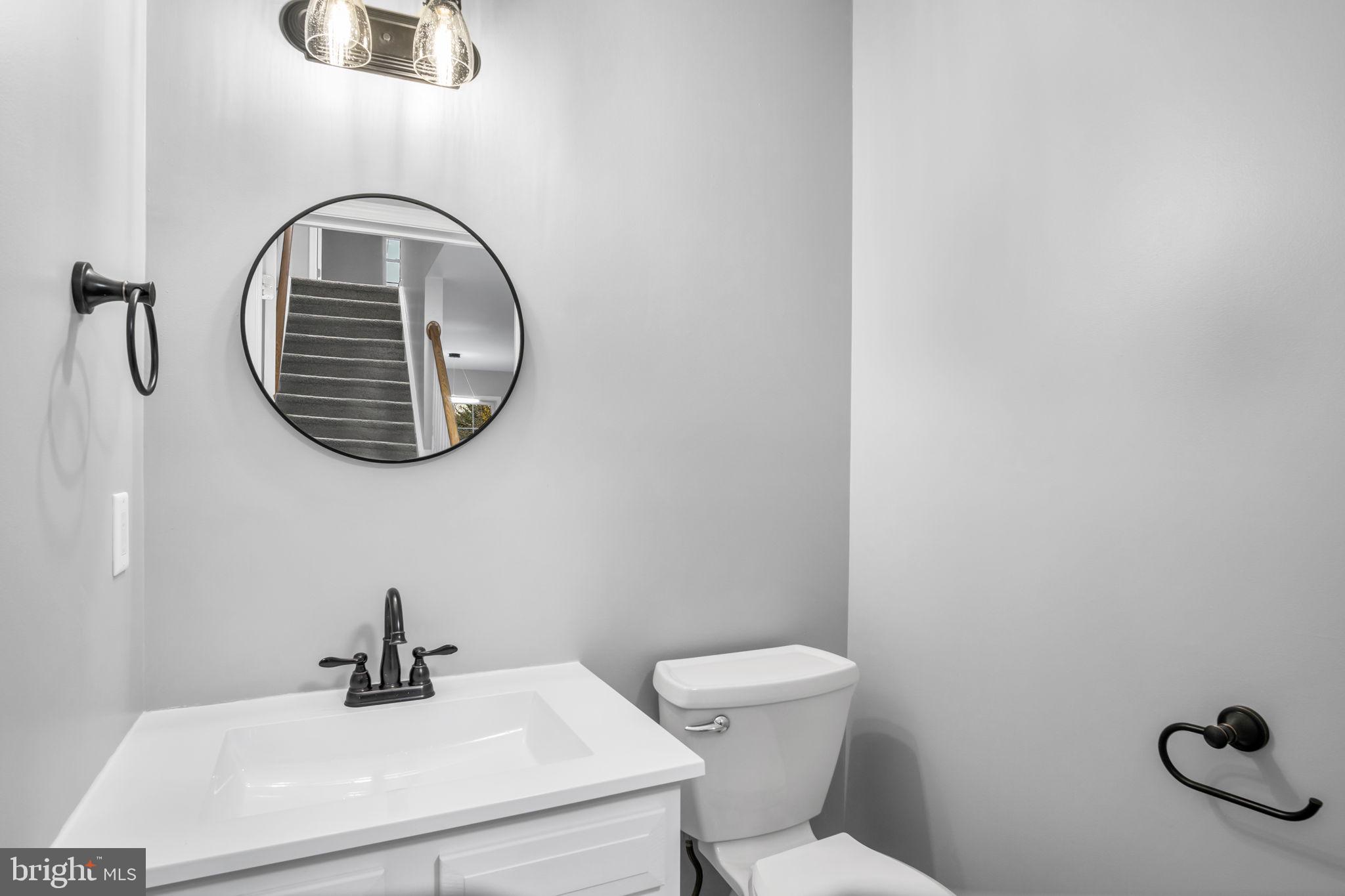 2 Sue Circle Lebanon, PA 17042 - Photo 13 of 32 a bathroom with a toilet a sink and a mirror