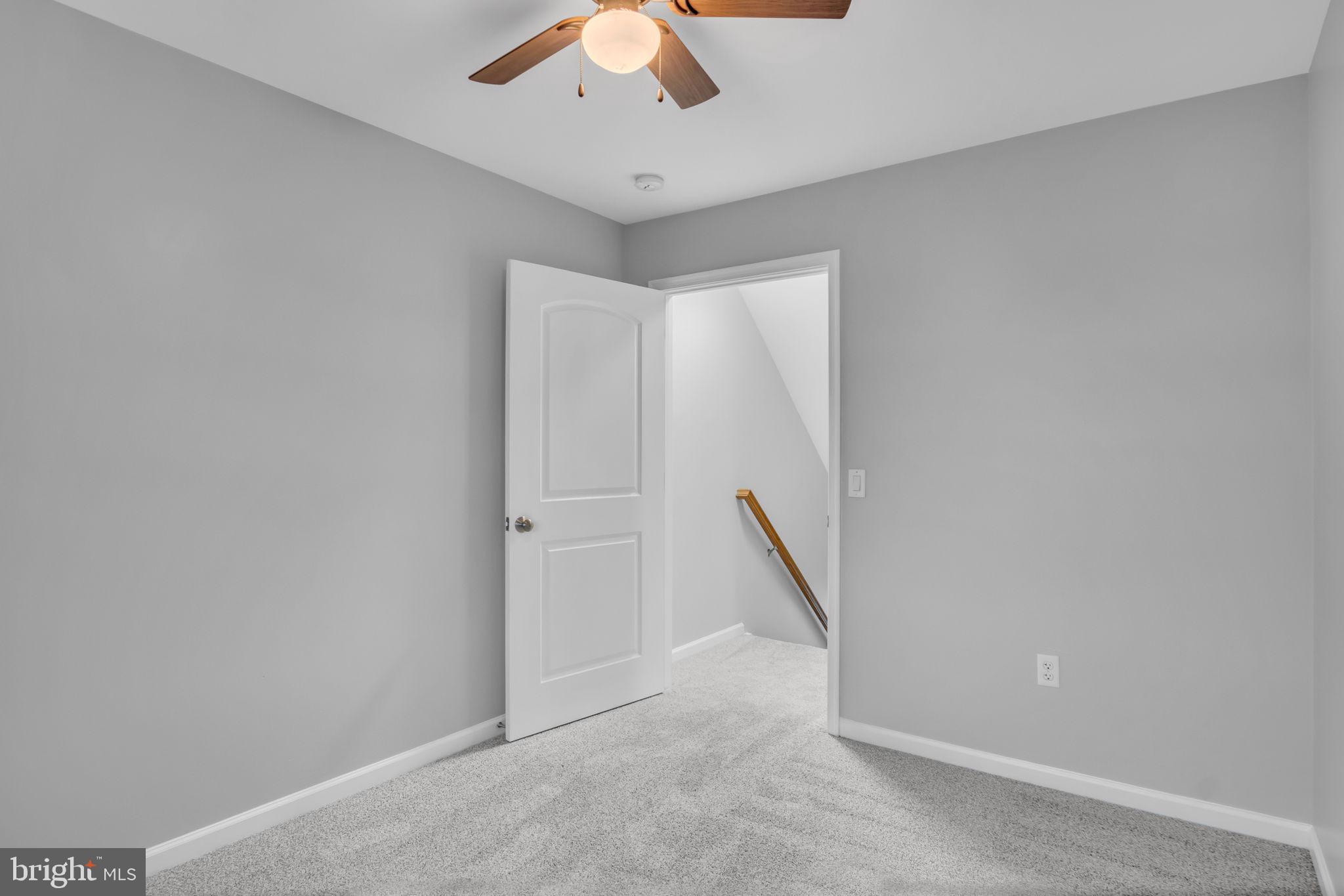2 Sue Circle Lebanon, PA 17042 - Photo 15 of 32 an empty room with a ceiling fan and carpet