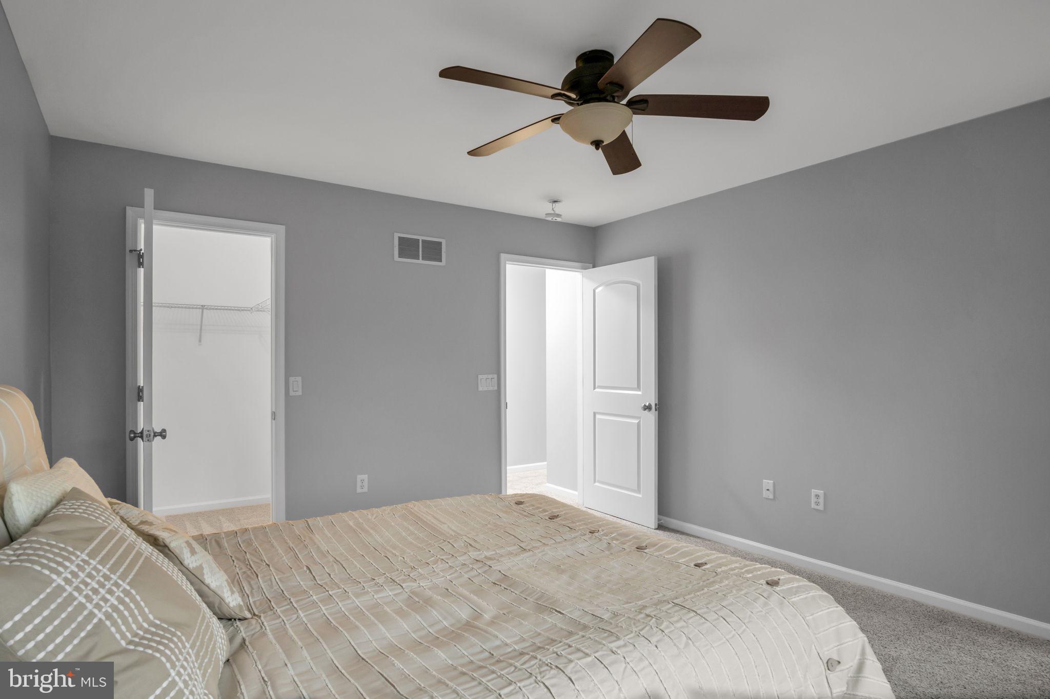 2 Sue Circle Lebanon, PA 17042 - Photo 21 of 32 a bedroom with a large bed and a chandelier