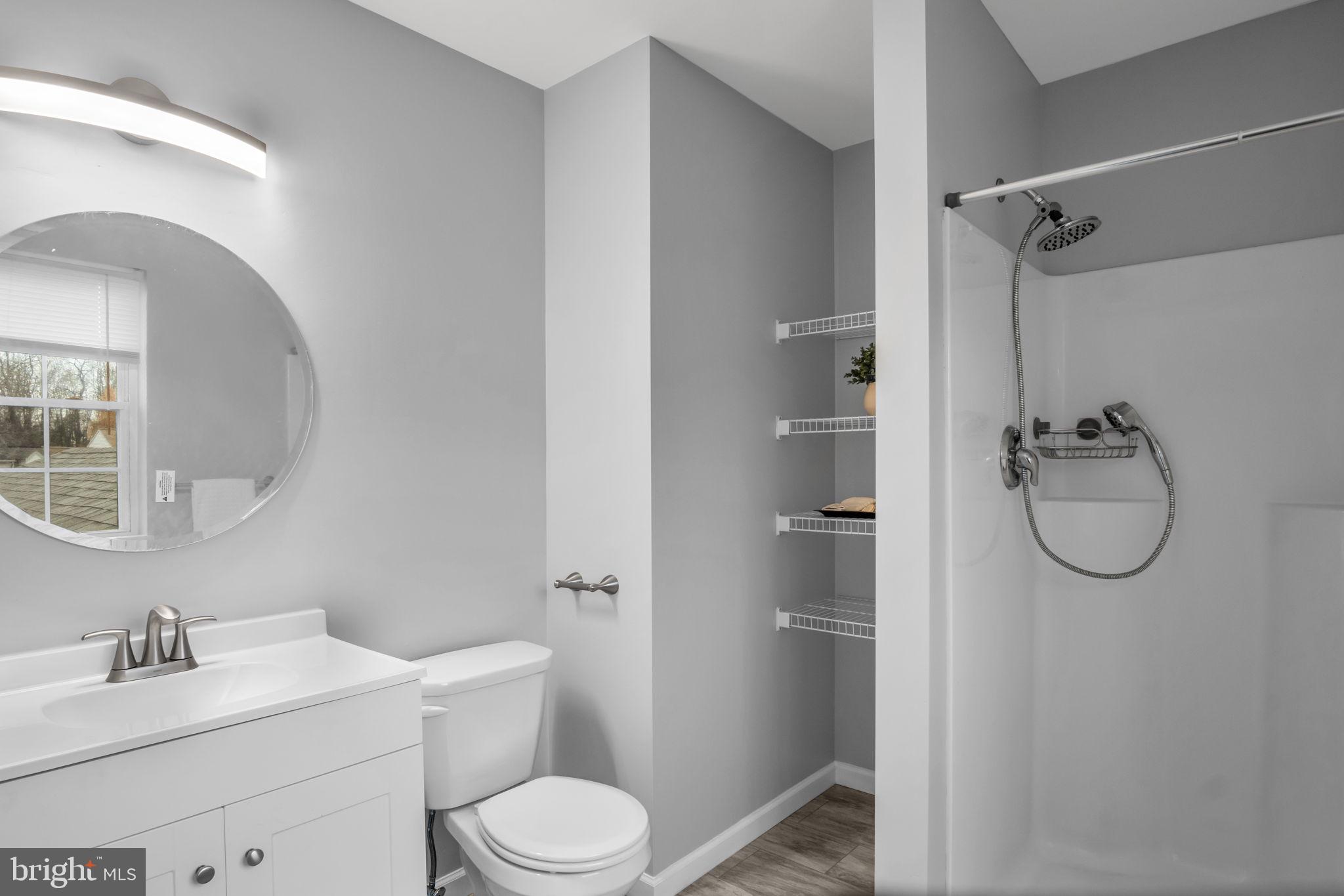 2 Sue Circle Lebanon, PA 17042 - Photo 22 of 32 a bathroom with a toilet sink vanity granite and shower