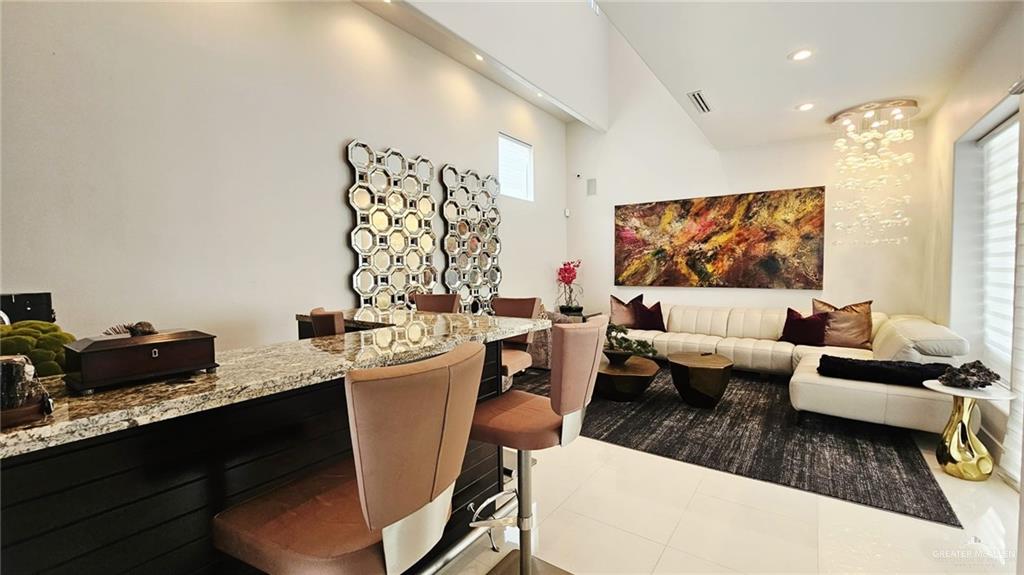 2213 South 48th Street McAllen, TX 78503 - Photo 11 of 28 a living room with furniture and a flat screen tv