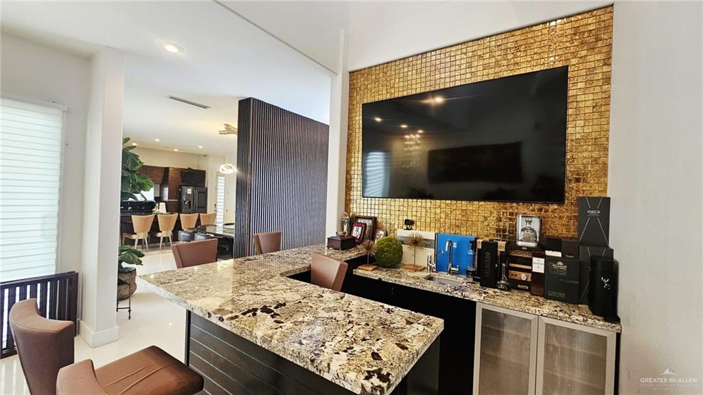 2213 South 48th Street McAllen, TX 78503 - Photo 12 of 28 a kitchen with a stove and a microwave