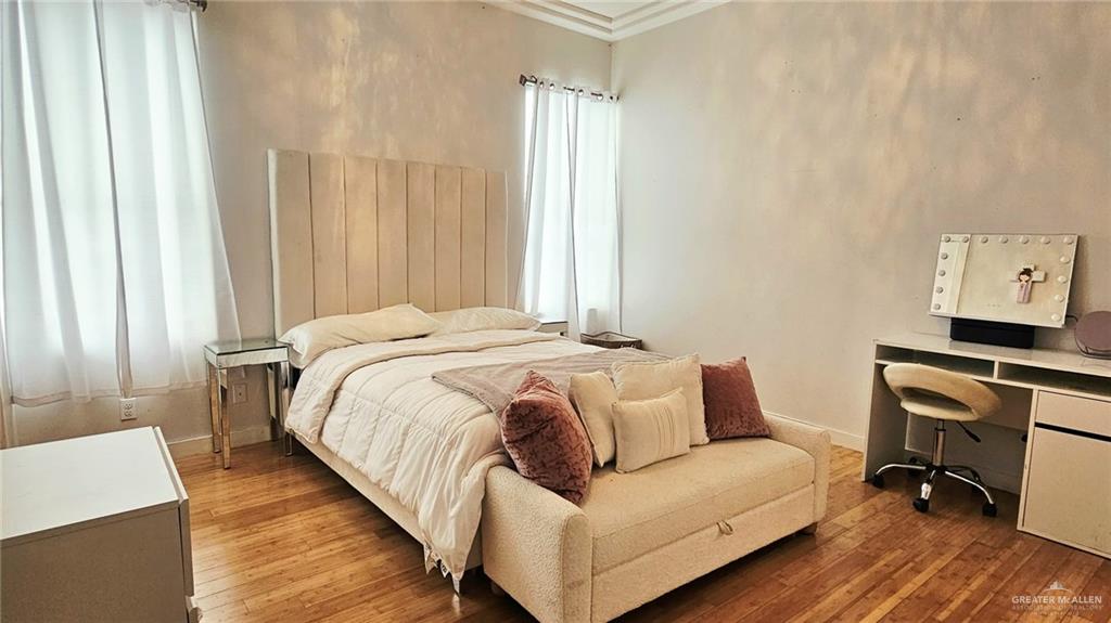 2213 South 48th Street McAllen, TX 78503 - Photo 18 of 28 a bedroom with a bed and a couch