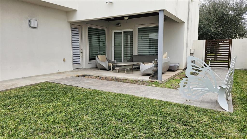 2213 South 48th Street McAllen, TX 78503 - Photo 23 of 28 a backyard of a house with seating space