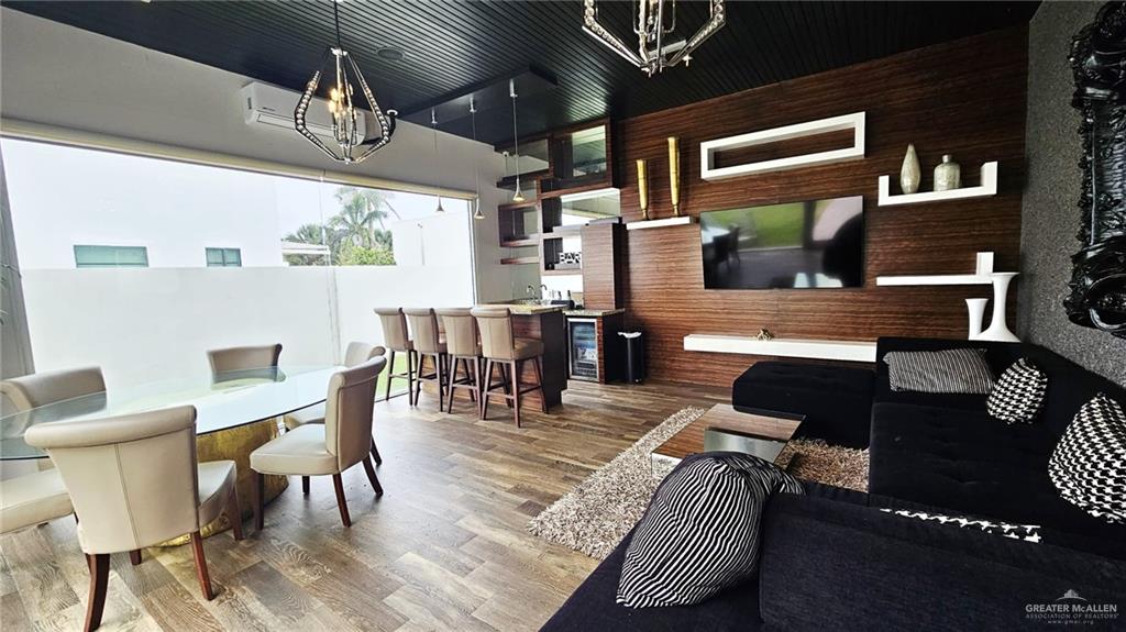 2213 South 48th Street McAllen, TX 78503 - Photo 26 of 28 a living room with furniture a rug and white walls