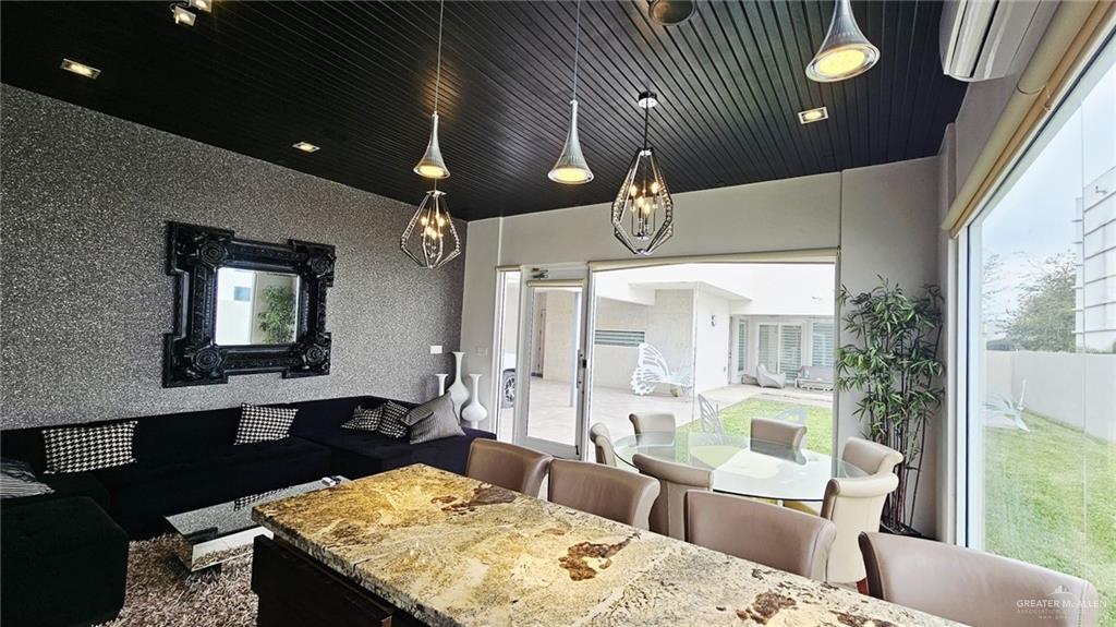 2213 South 48th Street McAllen, TX 78503 - Photo 27 of 28 a living room with furniture and a chandelier
