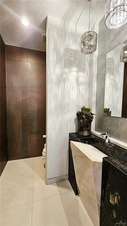 2213 South 48th Street McAllen, TX 78503 - Photo 28 of 28 a bathroom with a sink a mirror and a shower