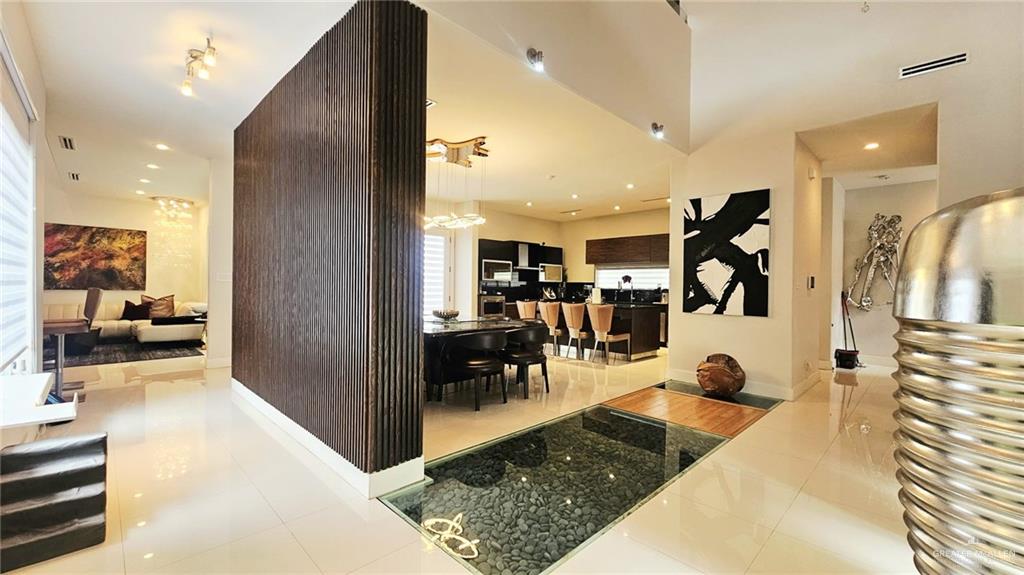 2213 South 48th Street McAllen, TX 78503 - Photo 6 of 28 a en suite bathroom with a tub and a view of living room