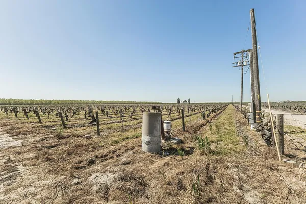 an aerial view of a house with a yard and lake view