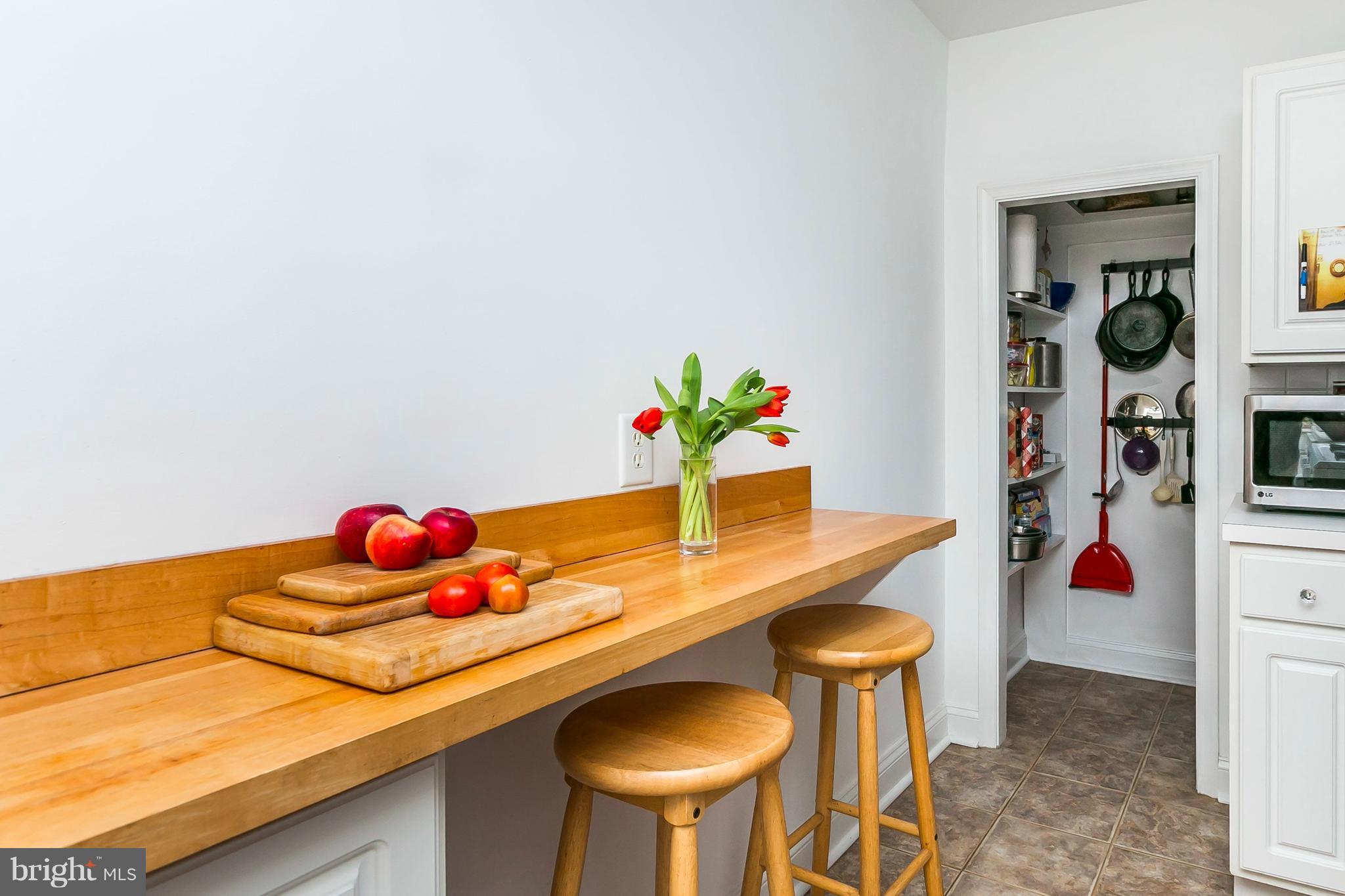 613 Deepdene Road Baltimore, MD 21210 - Photo 13 of 25 a kitchen with a table and chairs in it