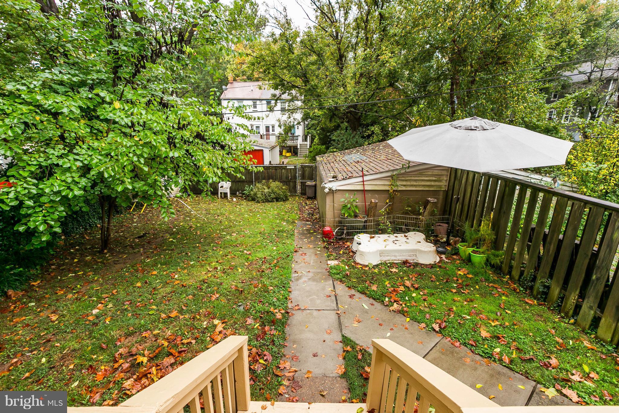 613 Deepdene Road Baltimore, MD 21210 - Photo 19 of 25 a backyard of a house with table and chairs