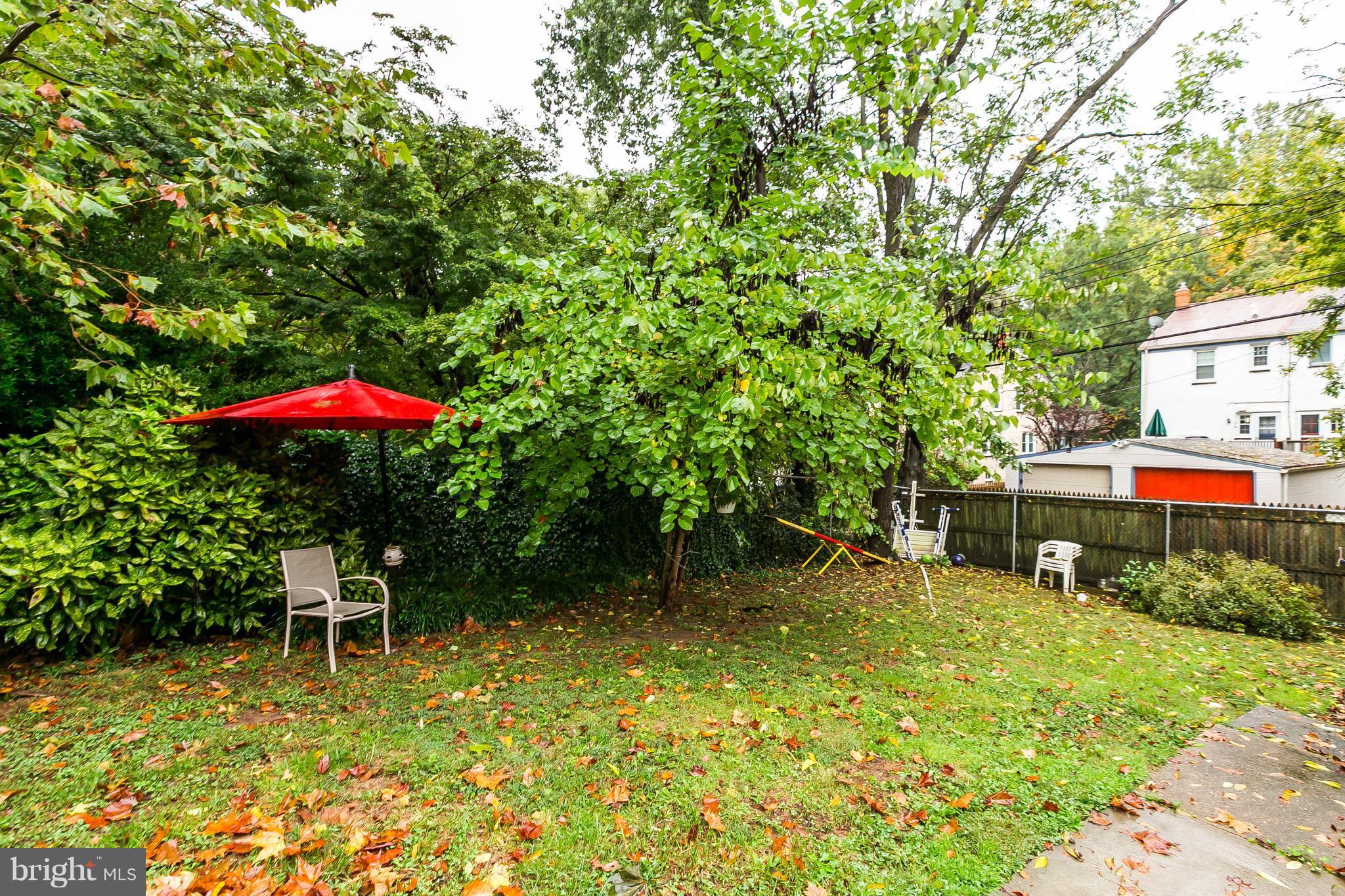 613 Deepdene Road Baltimore, MD 21210 - Photo 21 of 25 a backyard of a house with yard and outdoor seating