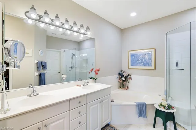 a bathroom with a sink double vanity and a mirror