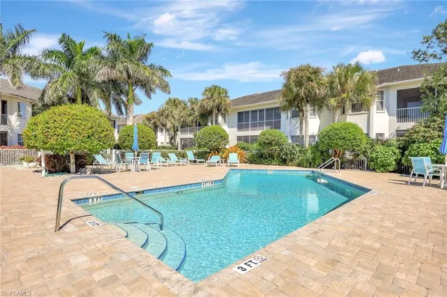 a view of a swimming pool with a patio