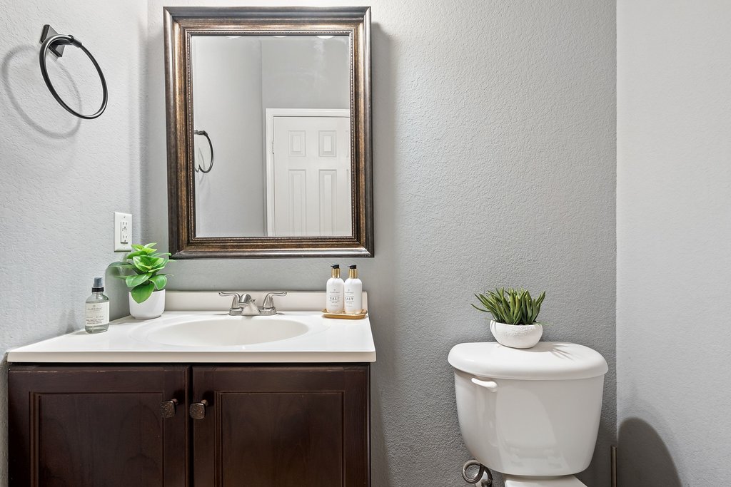 140 Wolfberry Path Buda, TX 78610 - Photo 34 of 35 a bathroom with a sink vanity and toilet