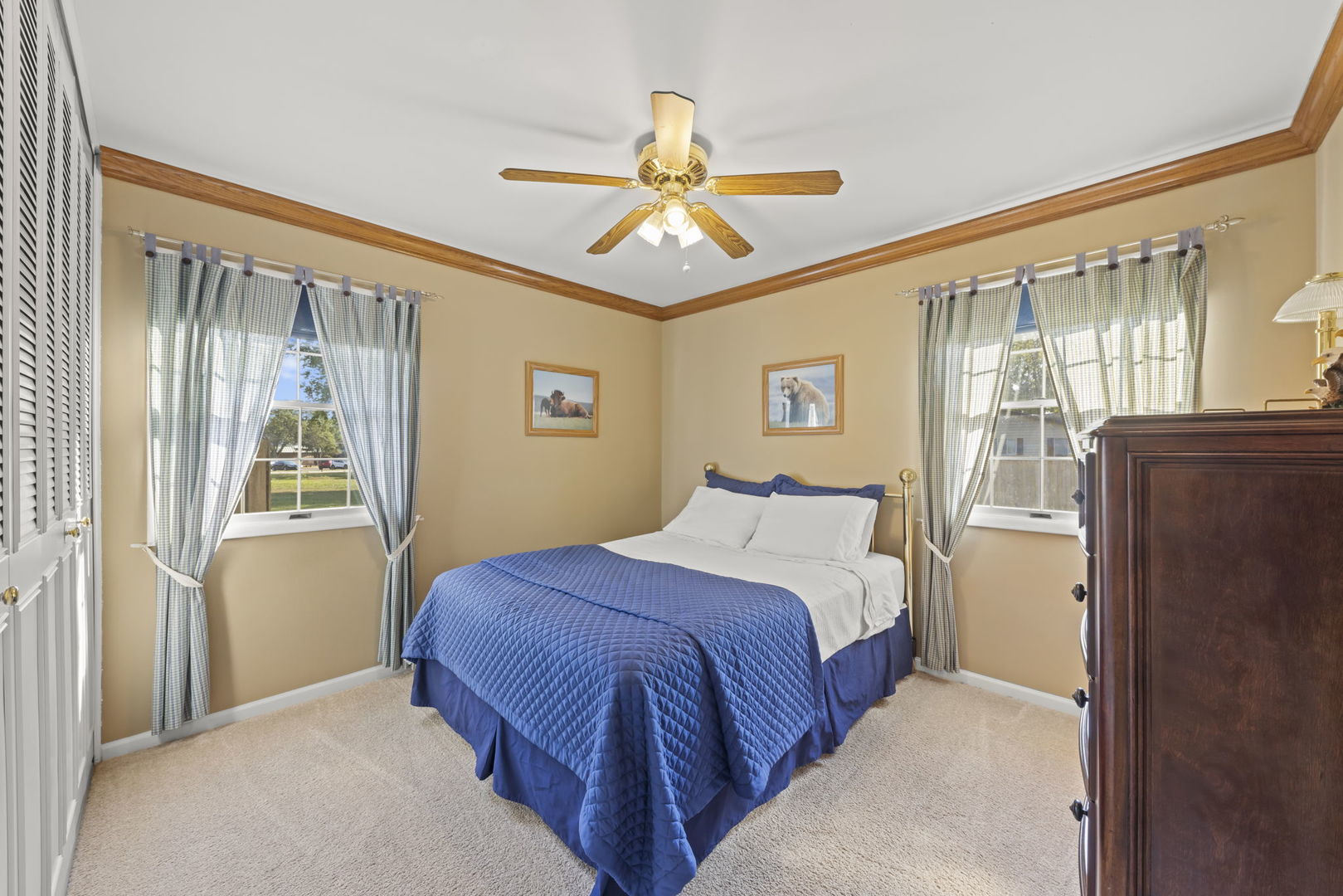 52 Winrock Road Montgomery, IL 60538 - Photo 12 of 28 a bedroom with a bed and a chandelier