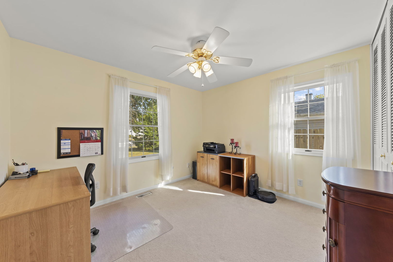 52 Winrock Road Montgomery, IL 60538 - Photo 13 of 28 a view of a workspace with furniture and a window