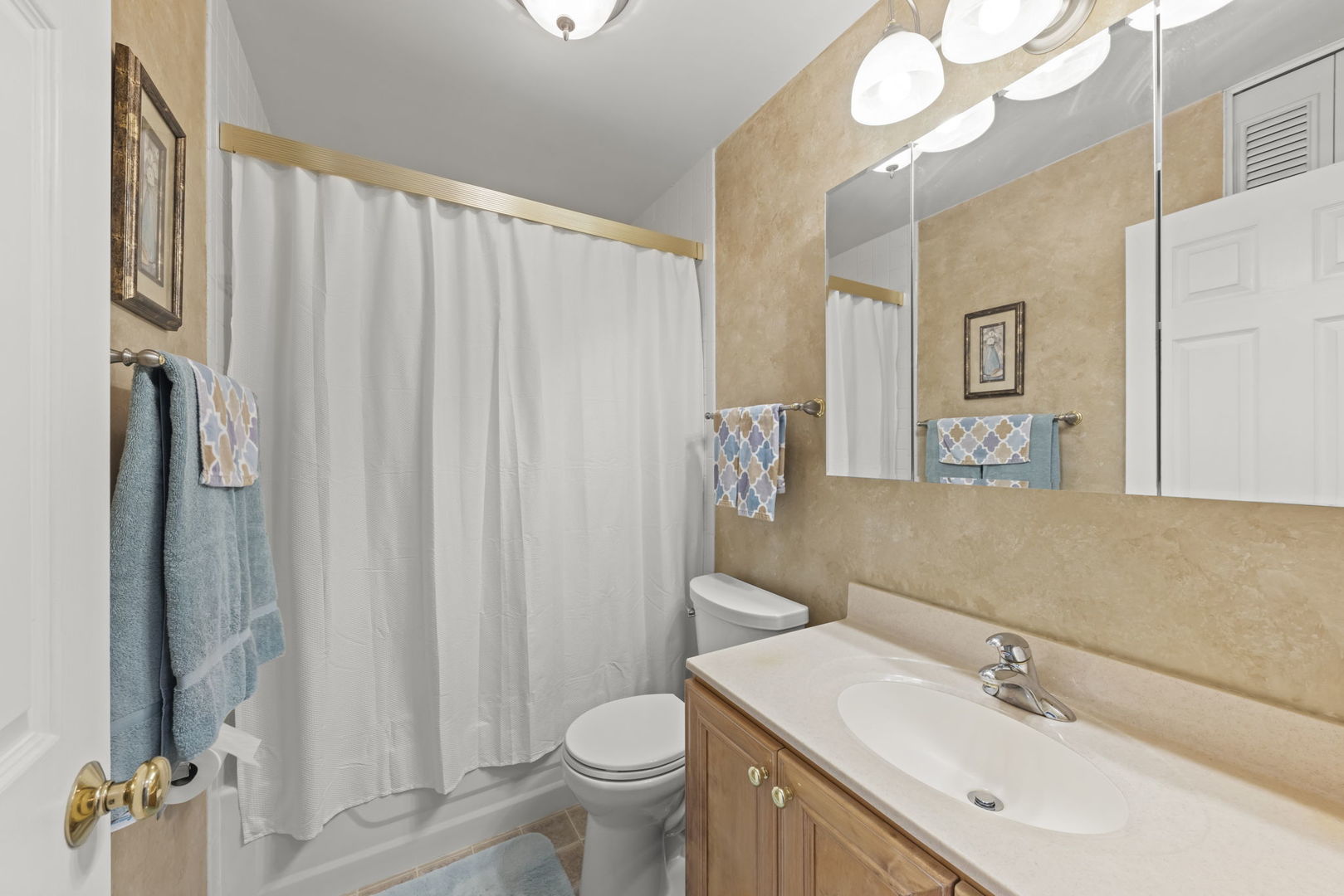52 Winrock Road Montgomery, IL 60538 - Photo 14 of 28 a bathroom with a sink vanity mirror and toilet