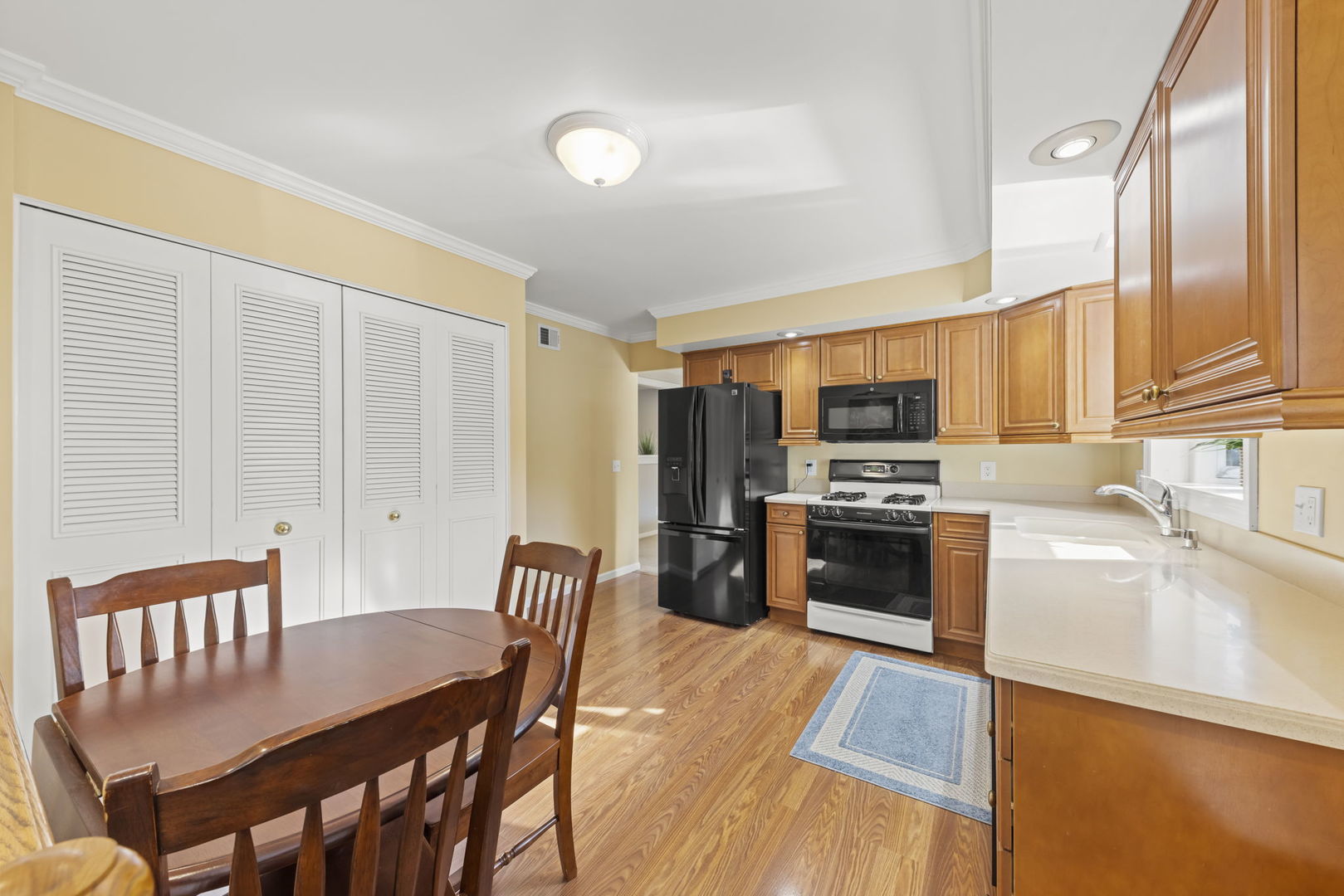 52 Winrock Road Montgomery, IL 60538 - Photo 8 of 28 a large kitchen with a table and chairs in it