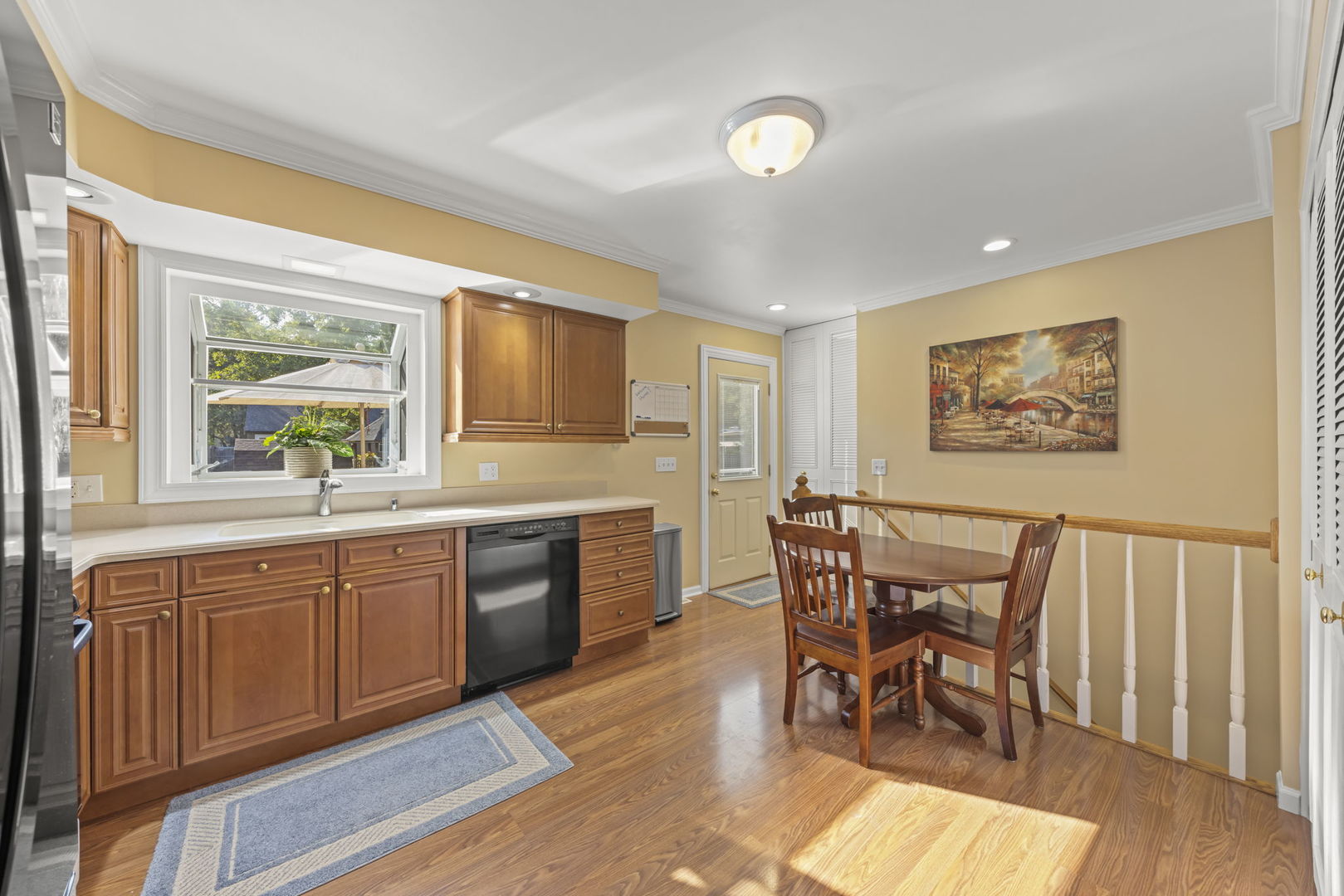 52 Winrock Road Montgomery, IL 60538 - Photo 9 of 28 a kitchen with stainless steel appliances granite countertop furniture wooden floor and a window