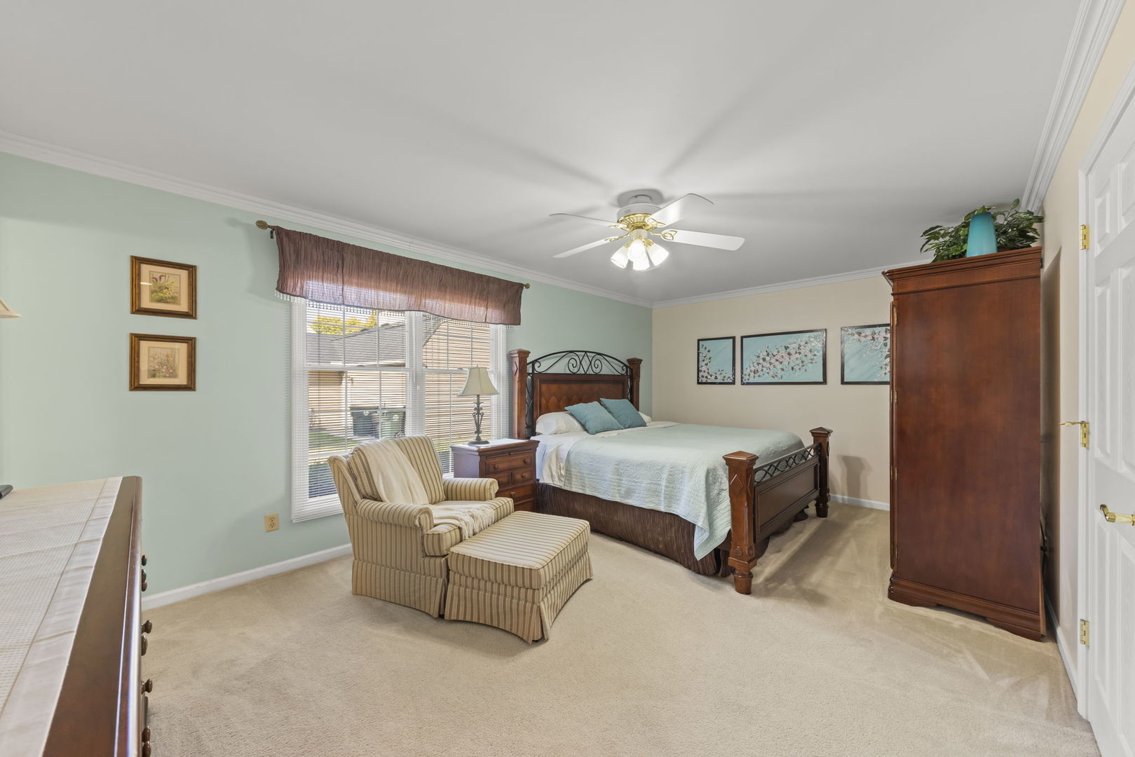 52 Winrock Road Montgomery, IL 60538 - Photo 10 of 28 a bedroom with furniture and a chandelier