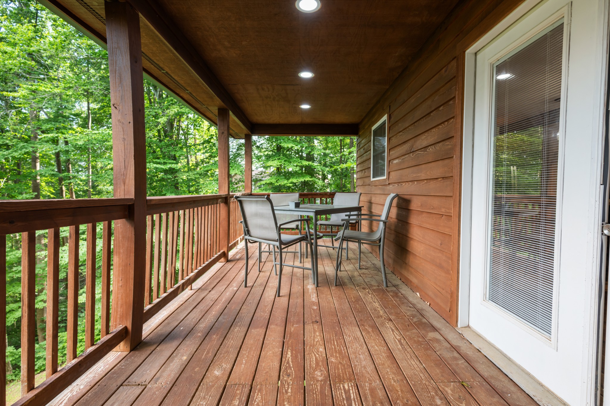 165 Kangaroo Ridge Road Byrdstown, TN 38549 - Photo 21 of 27 a view of a chairs and table in deck with wooden floor