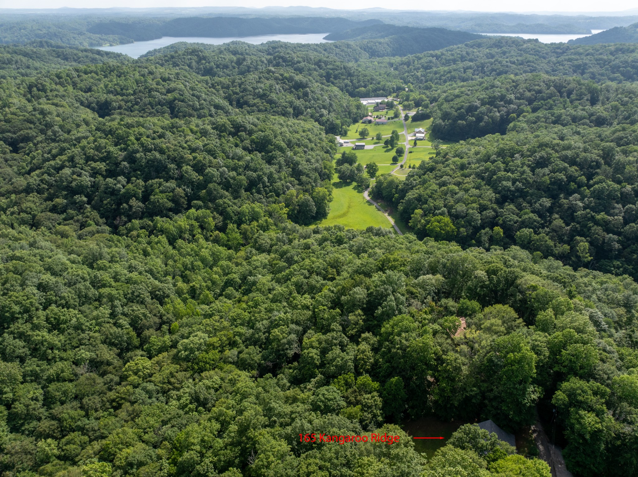 165 Kangaroo Ridge Road Byrdstown, TN 38549 - Photo 4 of 27 an aerial view of a house with a yard