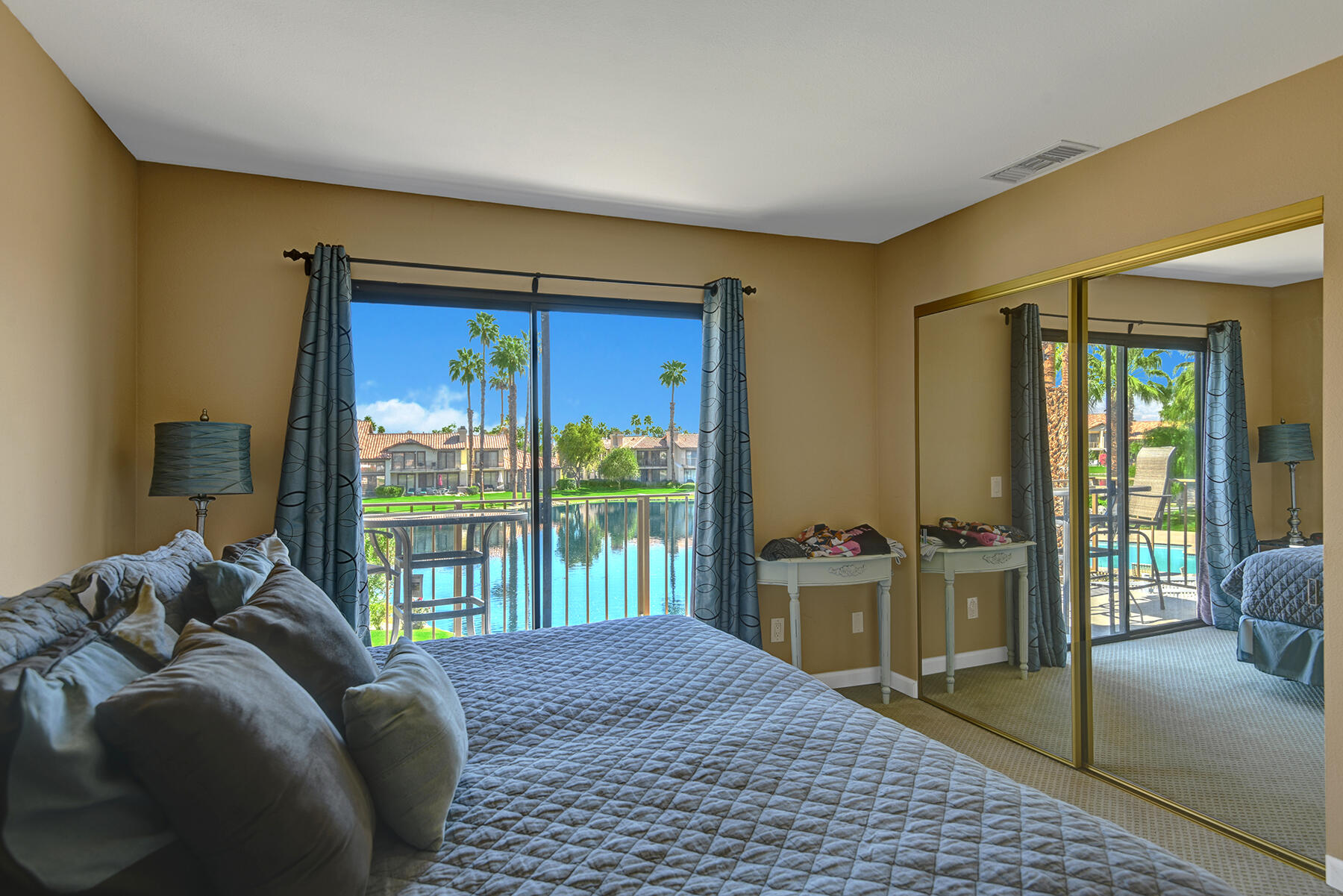 55108 Firestone La Quinta, CA 92253 - Photo 11 of 26 a bed sitting in a bedroom next to a window