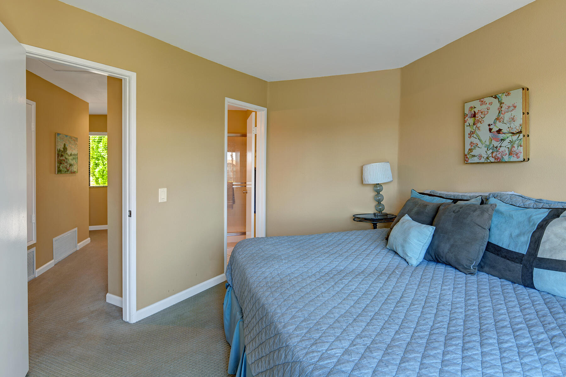 55108 Firestone La Quinta, CA 92253 - Photo 12 of 26 a bedroom with a bed and a painting on the wall
