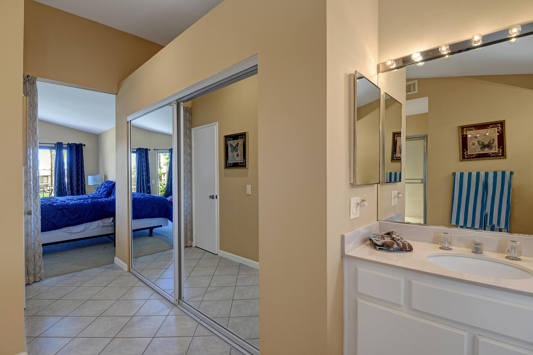 55108 Firestone La Quinta, CA 92253 - Photo 13 of 26 a bathroom with a sink and a mirror