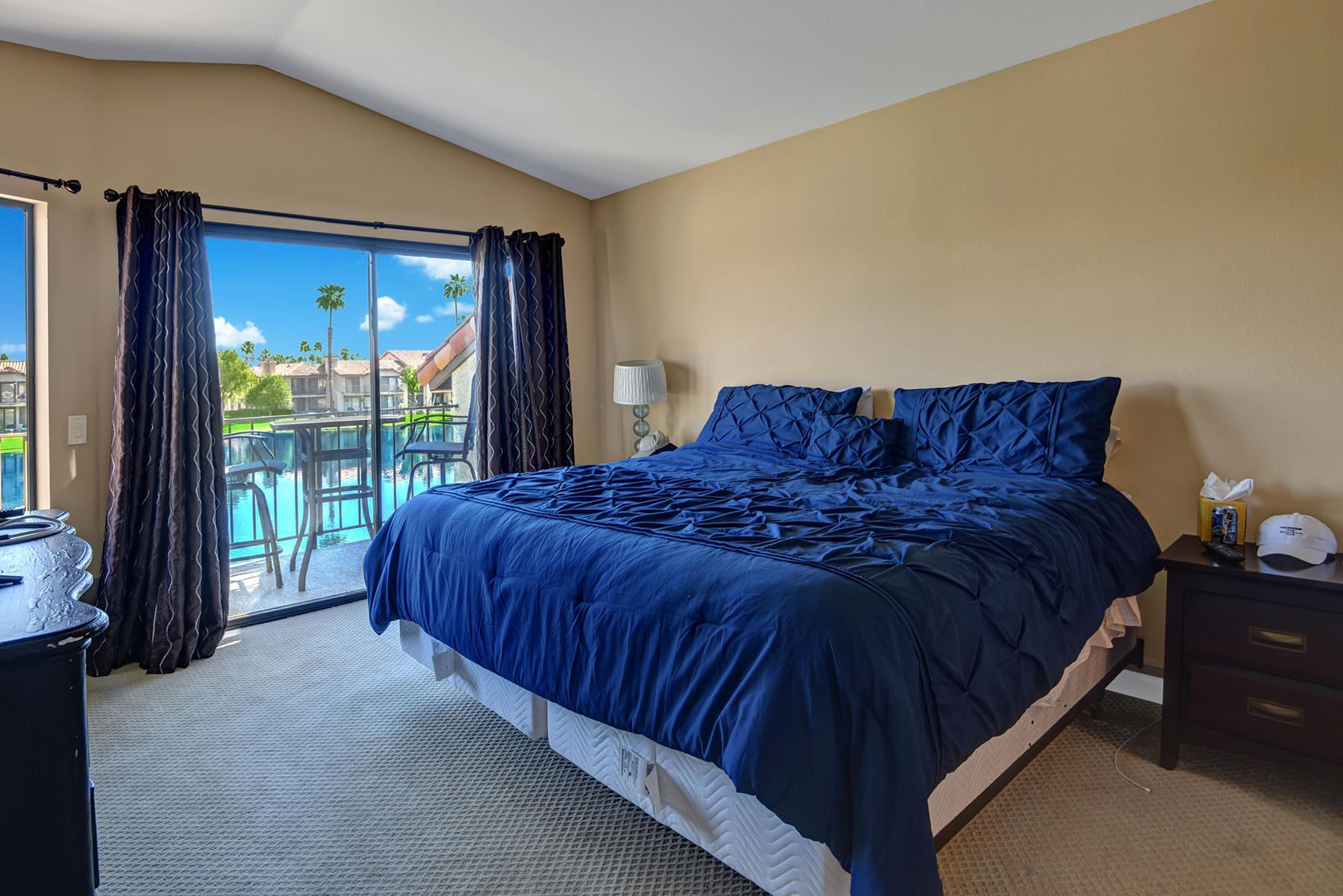 55108 Firestone La Quinta, CA 92253 - Photo 16 of 26 a large bed sitting in a bedroom next to a window