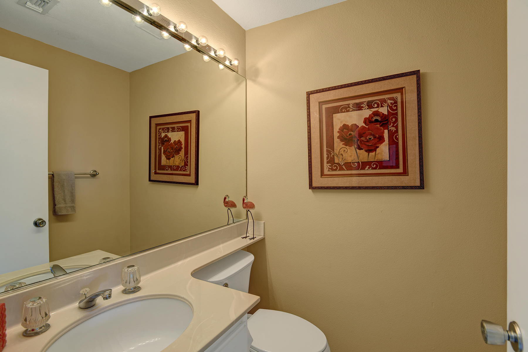 55108 Firestone La Quinta, CA 92253 - Photo 17 of 26 a bathroom with a toilet sink and mirror