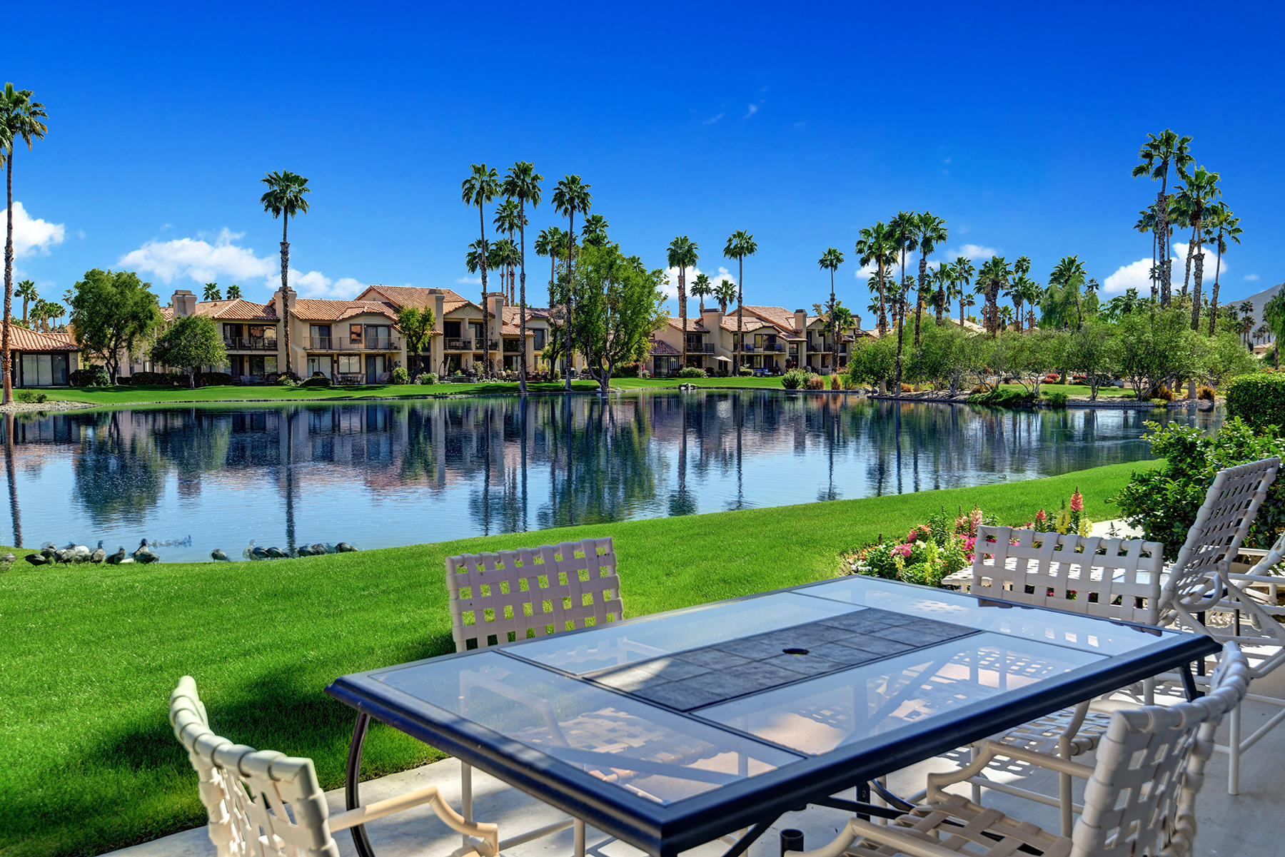 55108 Firestone La Quinta, CA 92253 - Photo 19 of 26 a view of a chairs and table on the deck