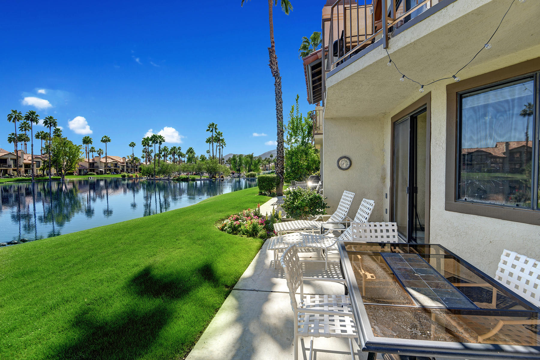55108 Firestone La Quinta, CA 92253 - Photo 21 of 26 a front view of a house with garden