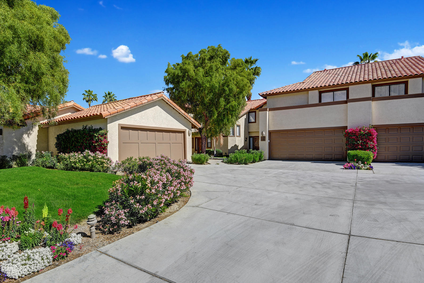 55108 Firestone La Quinta, CA 92253 - Photo 23 of 26 a view of a house with a yard and potted plants
