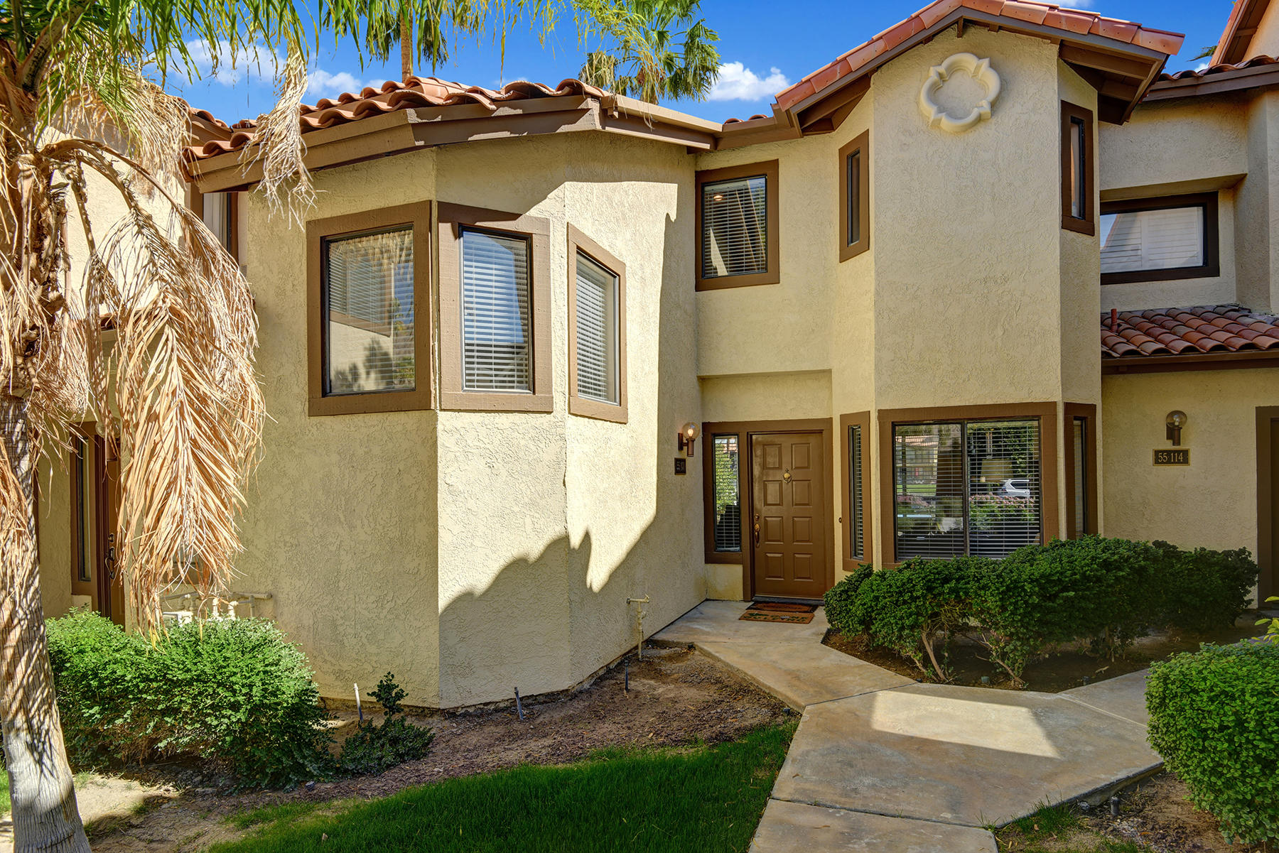 55108 Firestone La Quinta, CA 92253 - Photo 24 of 26 a front view of a house with a yard