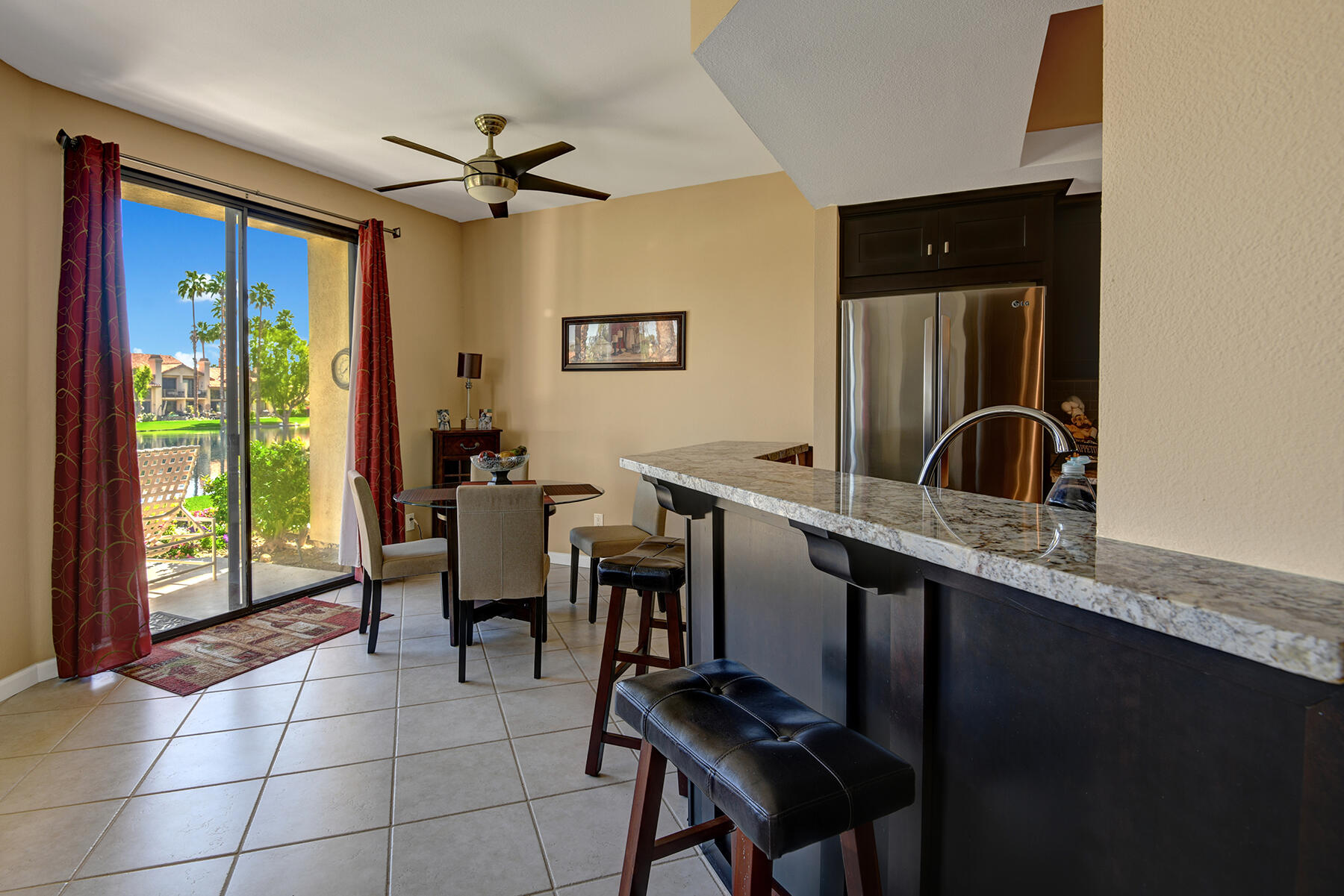 55108 Firestone La Quinta, CA 92253 - Photo 4 of 26 a view of a workspace with furniture and a window