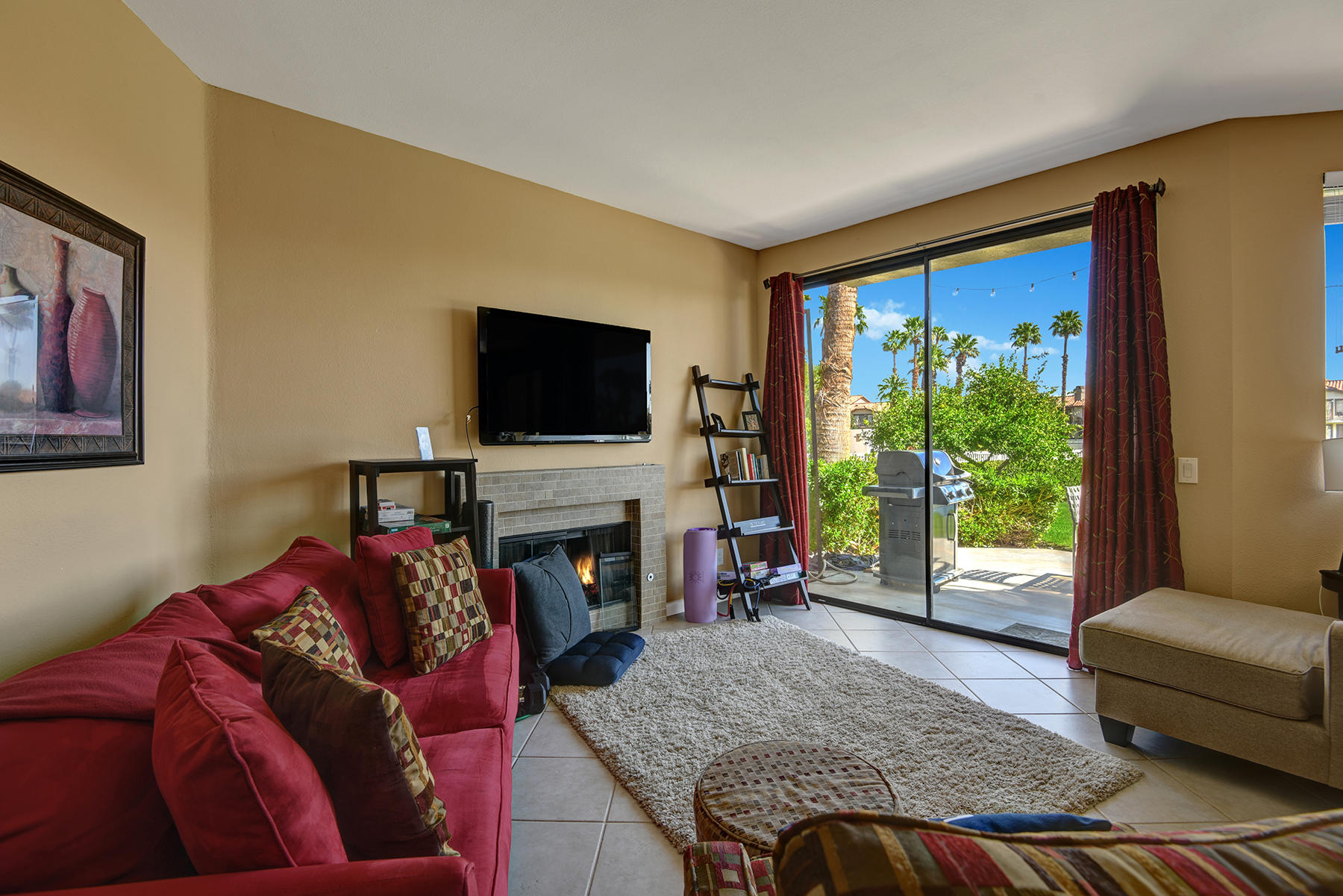 55108 Firestone La Quinta, CA 92253 - Photo 6 of 26 a living room with furniture and a fireplace