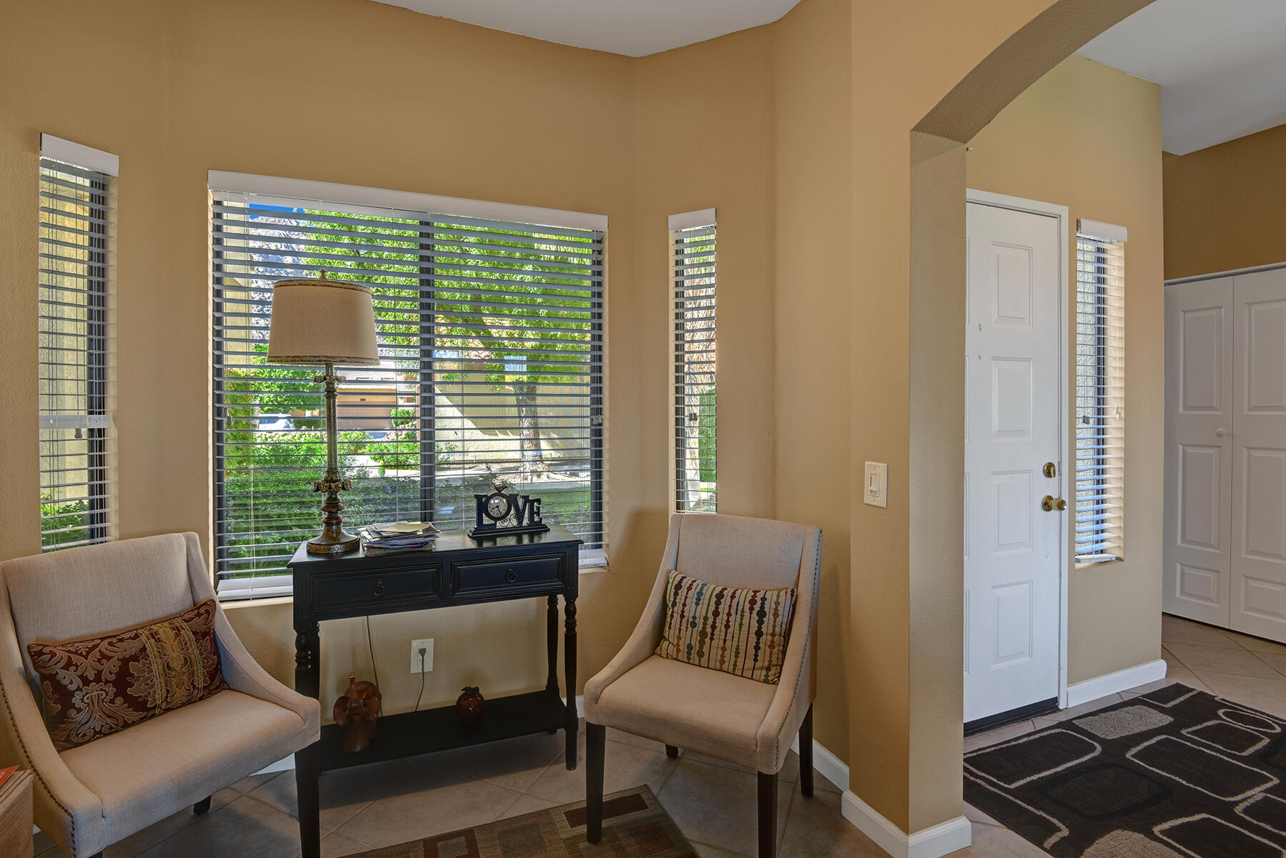 55108 Firestone La Quinta, CA 92253 - Photo 8 of 26 a living room with furniture and a window