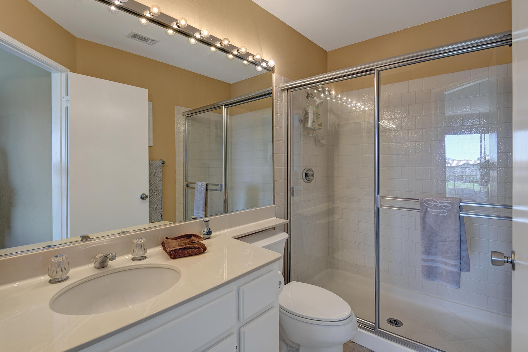 55108 Firestone La Quinta, CA 92253 - Photo 10 of 26 a bathroom with a sink a toilet and shower