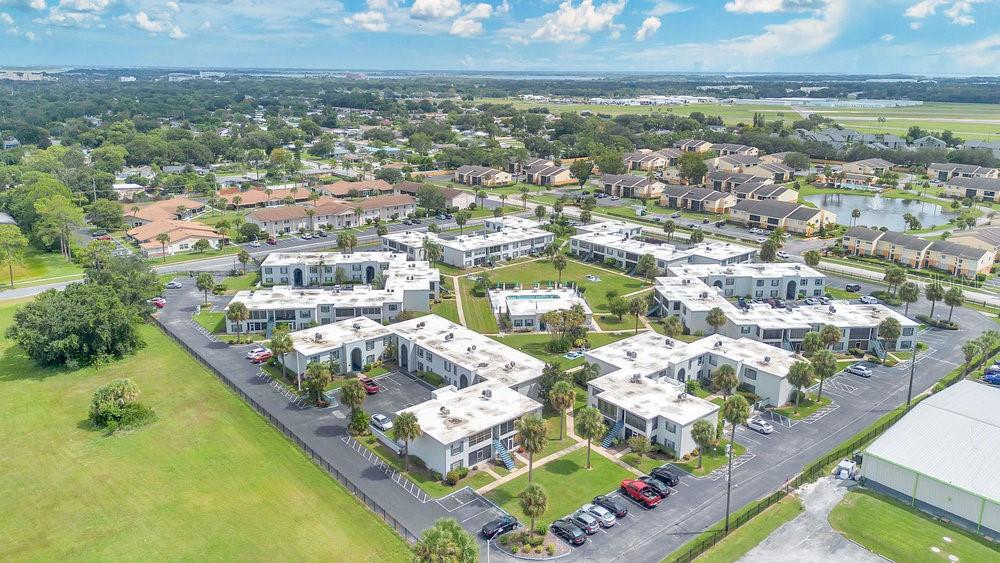 1024 North Plantation Drive, Unit B9 Kissimmee, FL 34741 - Photo 23 of 28 an aerial view of residential houses with outdoor space