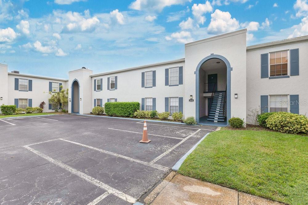 1024 North Plantation Drive, Unit B9 Kissimmee, FL 34741 - Photo 25 of 28 a front view of a house with a yard and garage
