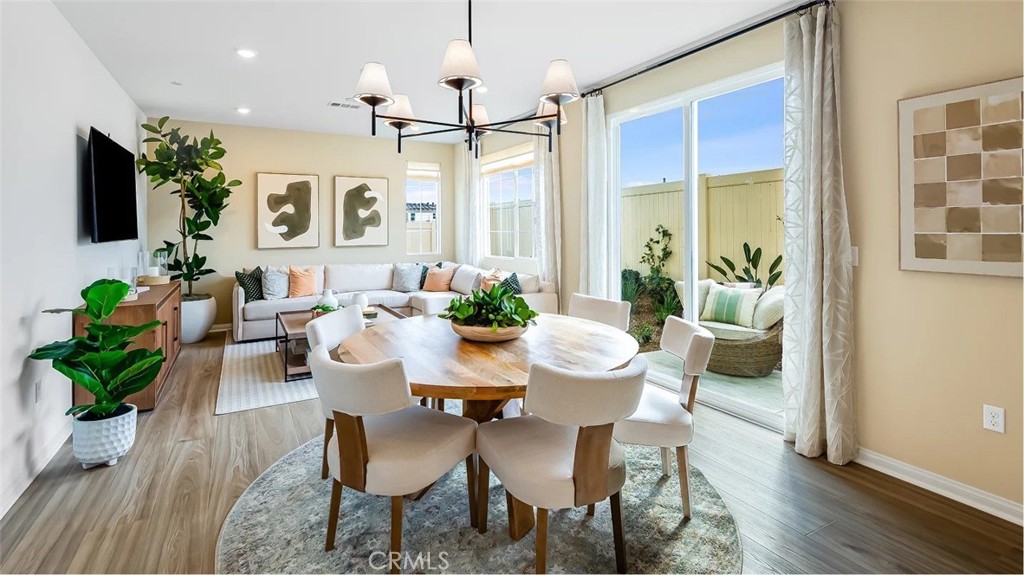 1678 Phantom Lane Rialto, CA 92376 - Photo 3 of 18 a view of a dining room with furniture window and wooden floor