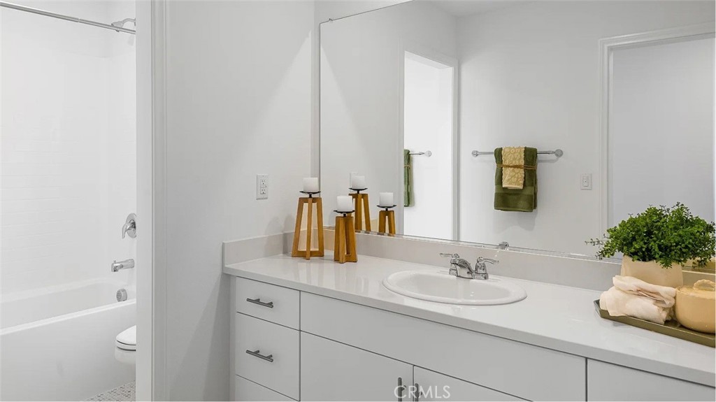 1678 Phantom Lane Rialto, CA 92376 - Photo 8 of 18 a bathroom with a sink and a mirror