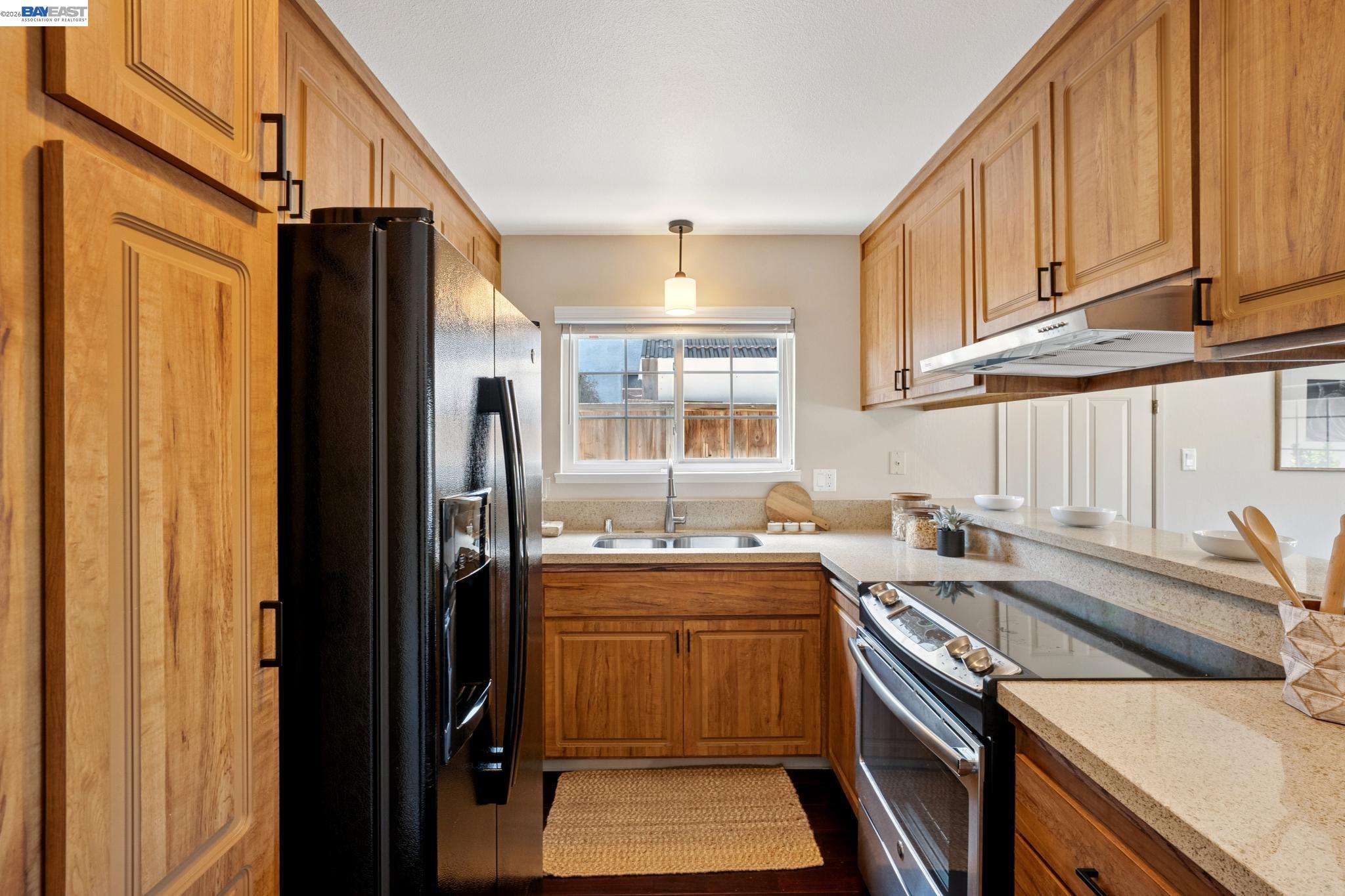 328 Sand Beach Road Alameda, CA 94501 - Photo 20 of 48 a kitchen that has a sink a stove and a refrigerator