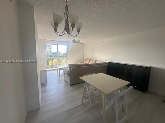 a workspace with furniture window and wooden floor