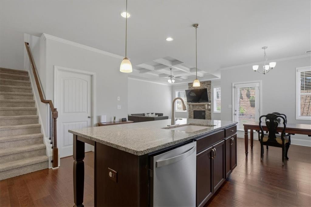 621 Little Bear Loop Canton, GA 30114 - Photo 13 of 45 a kitchen with center island table and chairs